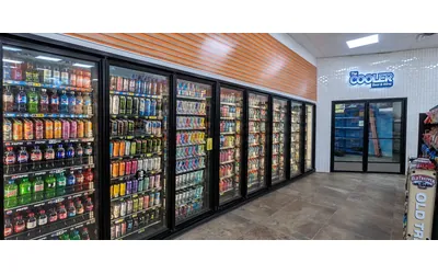 Stocked beer cave with glass display doors